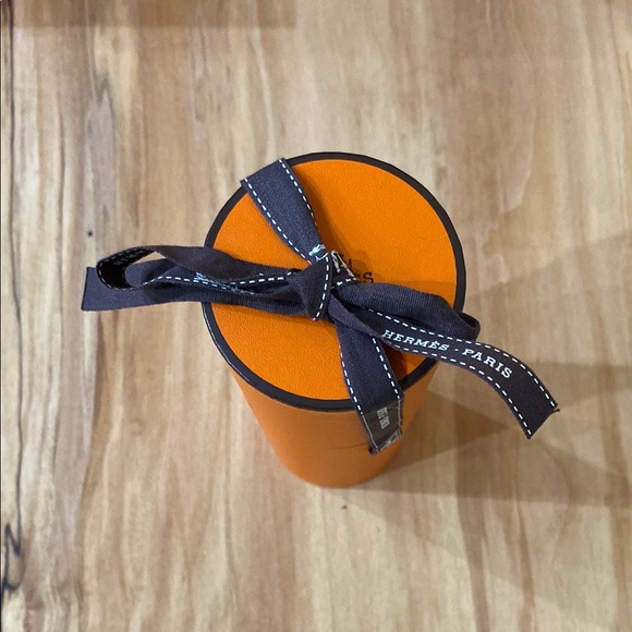 Hermes Other - Hermès Cylindrical Orange Box with Brown Ribbon